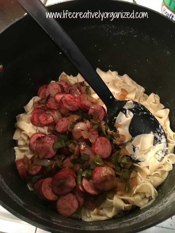 adding-kielbasa-pepper-mix-to-noodles-lco