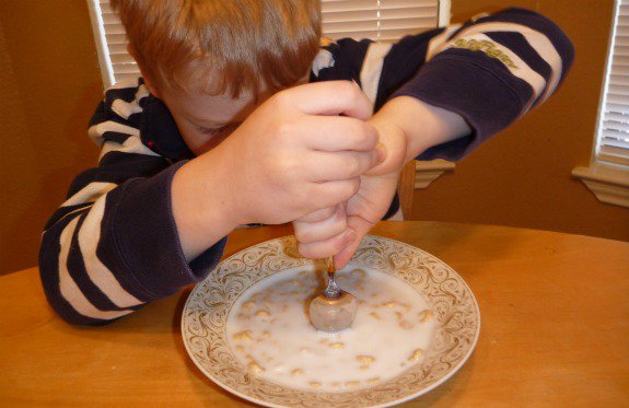 boy-digging-into-cereal-bowl