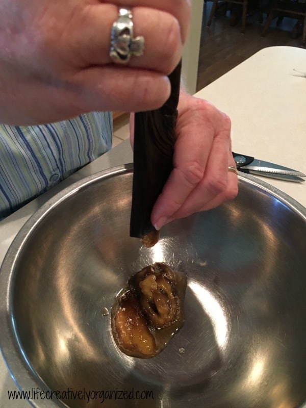 squeezing out thawed banana